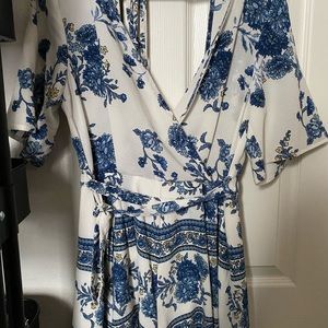 Romper with blue flowers , V-Neck